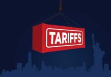 Boom! Tariff Shock Pushes Toyota to Texas Red shipping container labeled 'TARIFFS' suspended above a city skyline