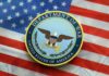 Seal of the Department of War on an American flag background