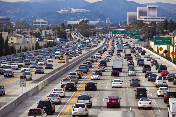 shutterstock_46893931 Heavy traffic on a multi-lane highway.