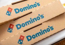 Domino’s Ditches Sharing? Stack of Domino's pizza boxes