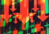 Paper Losses, Real Panic at DJT Red downward arrows over red and green stock candlestick chart
