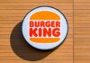 Burger King Overtakes Wendy’s — What Really Changed? Burger King logo displayed on a wooden wall