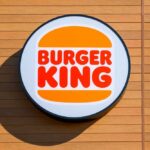 Burger King logo displayed on a wooden wall