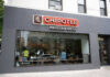 Chipotle Jalapeños Under Fire Chipotle Mexican Grill restaurant exterior with people inside.