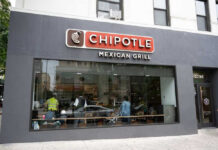 Chipotle Jalapeños Under Fire Chipotle Mexican Grill restaurant exterior with people inside.