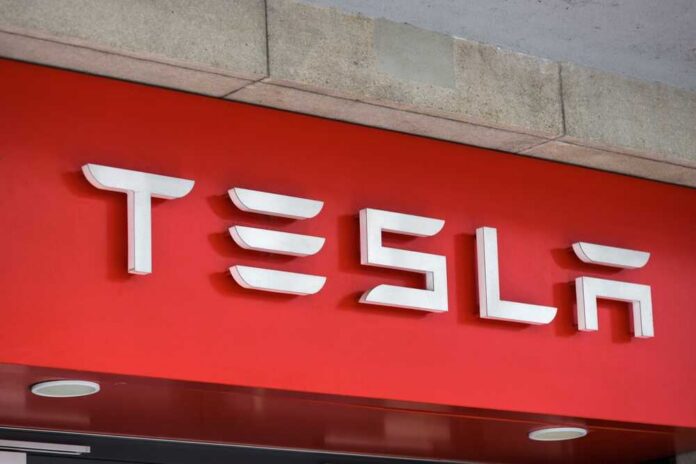Tesla logo displayed on a red background