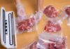 Deli Meat Recall Sparks Listeria Scare Hands wearing gloves vacuum sealing meat in plastic bags