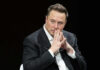 Ukraine Crowns Musk — Huge Honor Awarded Elon Musk in suit thinking.
