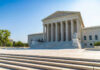 Supreme Swerve Keeps $400M Ballroom Alive United States Supreme Court building exterior, sunny day.
