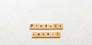 Wooden letter tiles forming words on a white textured surface
