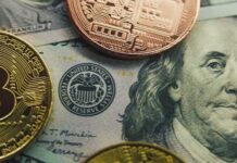 Bitcoin ‘Cold’ Wallets Cracked — Millions Vanish Close-up of a Bitcoin and other coins on a US dollar bill