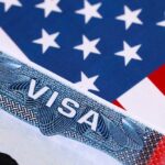 Visa Purge Incoming — 200,000 On The Line Close-up of a US visa on a background of the American flag