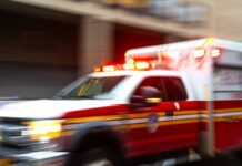 Deadly Brain-Eating Amoeba Terror After Lake Swim Ambulance with flashing lights speeding through a city street