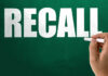 Dog Food Recall Triggers Illness Alert Hand holding chalk writing on green chalkboard