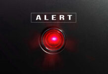 ALERT: Metal Shards Lurking In Popular Comfort Food Red alert light against black background, text ALERT.