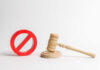 Court Slams Trump Name Gambit Wooden judge's gavel beside a red prohibition symbol