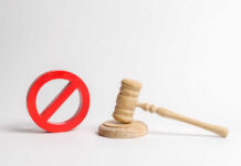 Court Slams Trump Name Gambit Wooden judge's gavel beside a red prohibition symbol