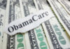 BOMBSHELL: Windfall Checks Hit Obamacare Enrollees ObamaCare text over money background.