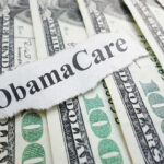 ObamaCare text over money background.