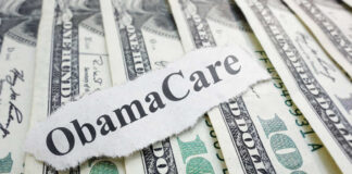 ObamaCare text over money background.