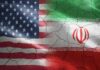 Voters Revolt: Iran War Backfires Flags of the United States and Iran blended together with a cracked texture