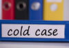 MURDER: Cold-Case Mother ID’d Blue binder labeled 'cold case' with other colored binders in the background