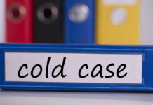 MURDER: Cold-Case Mother ID’d Blue binder labeled 'cold case' with other colored binders in the background