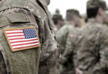 Moon War Warning From America’s Top General U.S. soldiers in camouflage uniforms with American flag patch.