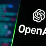 Smartphone displaying OpenAI logo on a keyboard