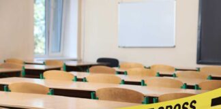 Empty classroom blocked by police tape