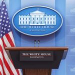 Ballroom Brawl Hits Supreme Court White House press briefing podium with microphones and U.S. flag