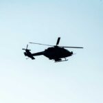 Marine One Scare Sparks FAA Probe Silhouette of a helicopter flying against a light sky