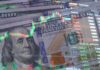 US dollar bills with overlaid stock market charts