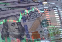 US dollar bills with overlaid stock market charts