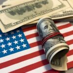Shock Pledge: Cash Only If GOP Wins A roll of hundred dollar bills placed on an American flag