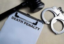 UPDATE: First Woman Executed Since 1819? Clipboard with death penalty document beside gavel and handcuffs