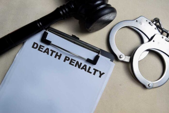 Clipboard with death penalty document beside gavel and handcuffs