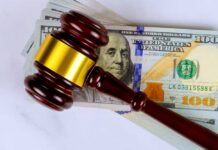 IRS Gutted, Billions Vanish Judge’s gavel on a stack of U.S. hundred-dollar bills