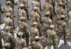 FINALLY: Pentagon Pulls Last Troops (VIDEO) Timmy Jernigan among soldiers marching in formation on a street