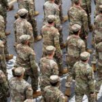 FINALLY: Pentagon Pulls Last Troops (VIDEO) Timmy Jernigan among soldiers marching in formation on a street
