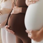 Amazon vs. Pregnant Workers — Huge News Pregnant women standing side by side holding their bellies