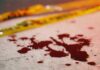 Two Bloodbath Attacks Leave 27 Dead Blood droplets on pavement near yellow caution tape