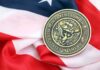Trump’s Navy Shake-Up Has New Leader Navy medal resting on an American flag