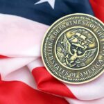 Navy medal resting on an American flag