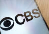 CBS Drops Romo After OWI Twist CBS logo displayed on a smartphone screen