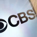 CBS Drops Romo After OWI Twist CBS logo displayed on a smartphone screen