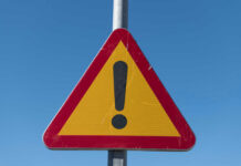 VIDEO: Deadly Rear-End Smash Triangular warning sign with exclamation mark.