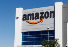 Exterior view of an Amazon building with a prominent logo