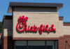 Chick-fil-A restaurant sign on a brick building