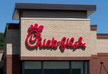 CEO Draws Line: No AI At Window Chick-fil-A restaurant sign on a brick building